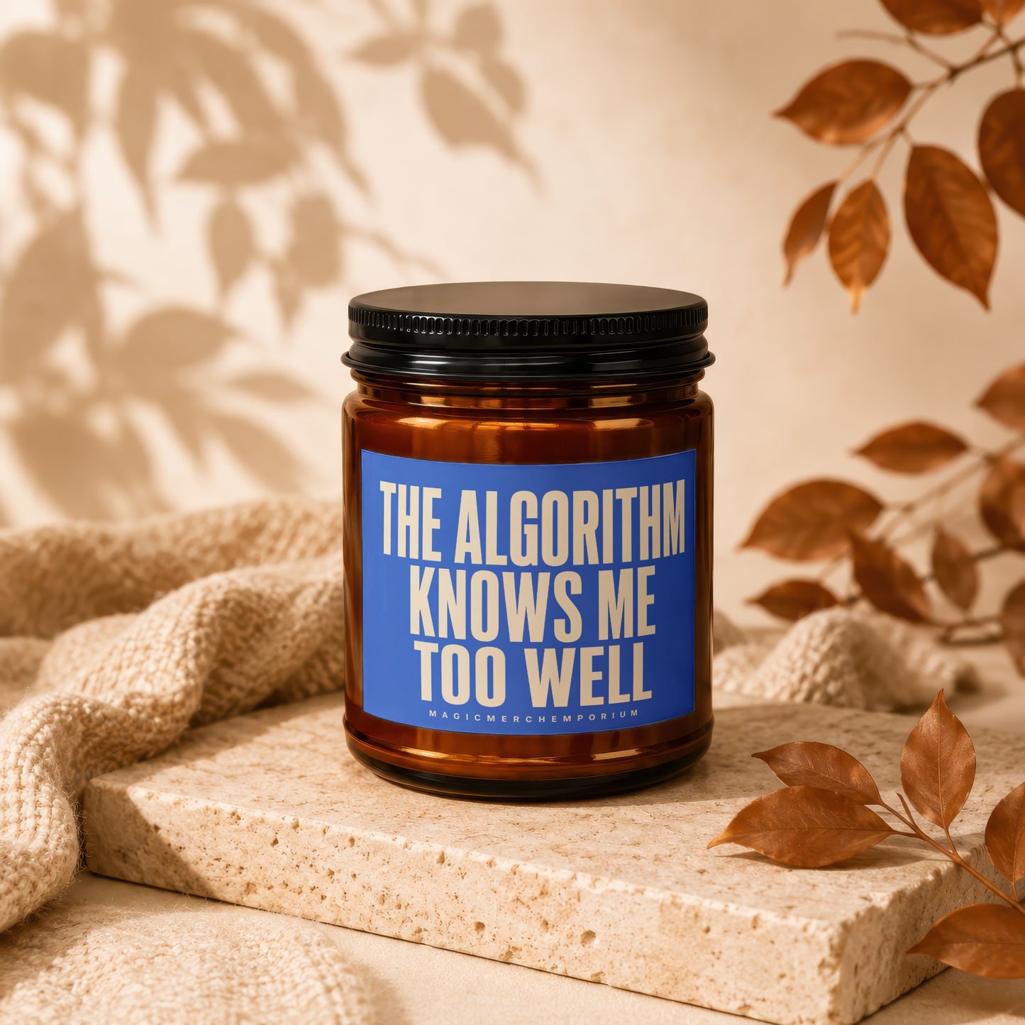 Amber candle with "The Algorithm Knows Me Too Well" text on blue label.