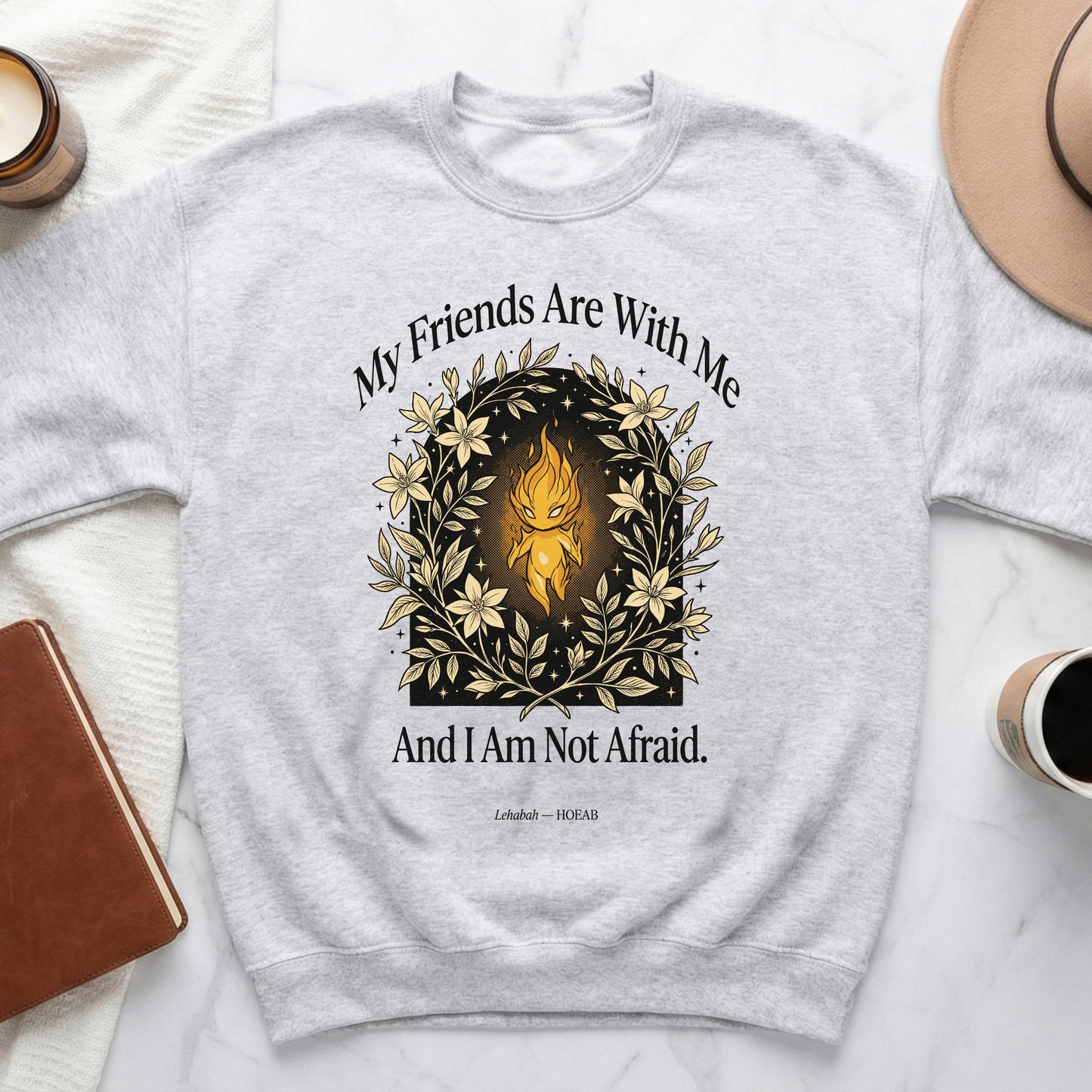 Light-colored sweatshirt with floral wreath and text "My Friends Are With Me And I Am Not Afraid."