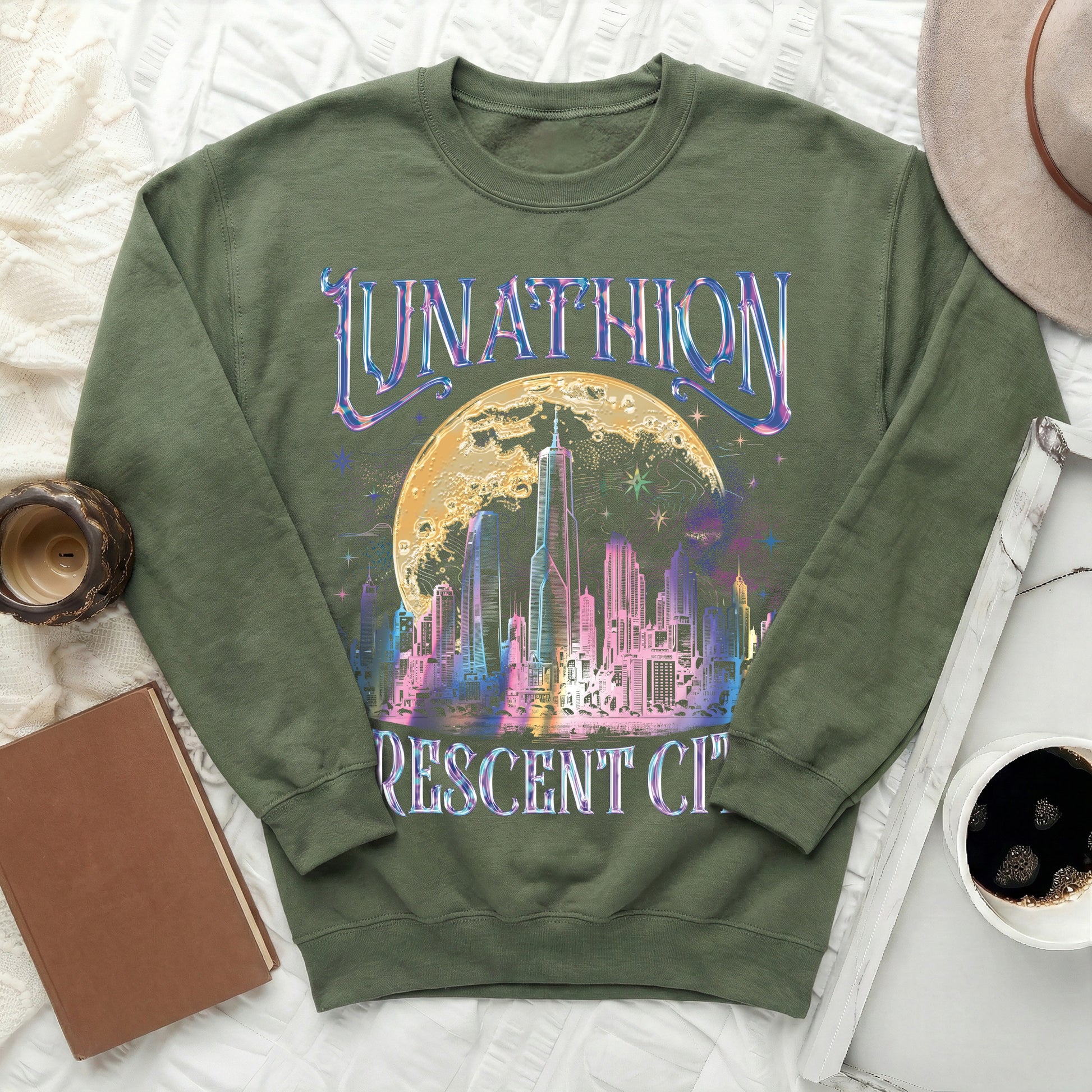 Olive green sweatshirt with "LUNATHION CRESCENT CITY" text and futuristic city skyline graphic.