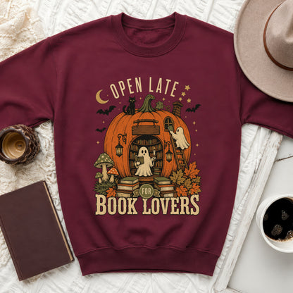 Maroon sweatshirt with Halloween-themed "Open Late for Book Lovers" ghost and pumpkin library graphic.
