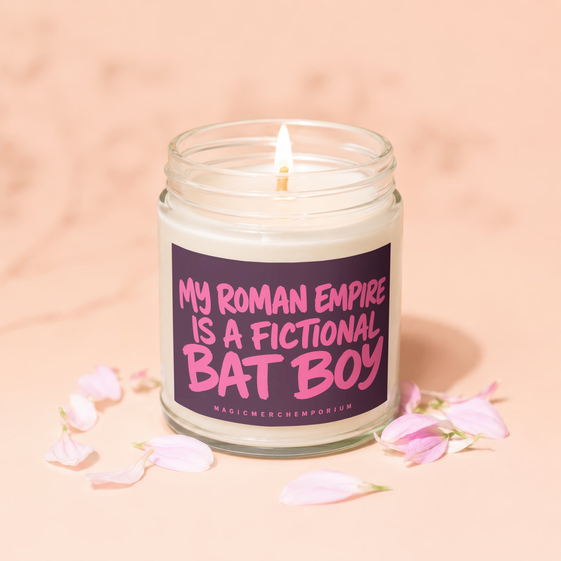 Lit glass candle with text "My Roman Empire is a fictional Bat Boy".