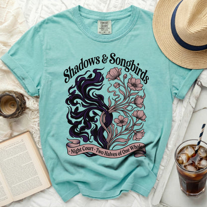 Teal t-shirt with "Shadows & Songbirds Night Court Two Halves of One Whole" graphic.