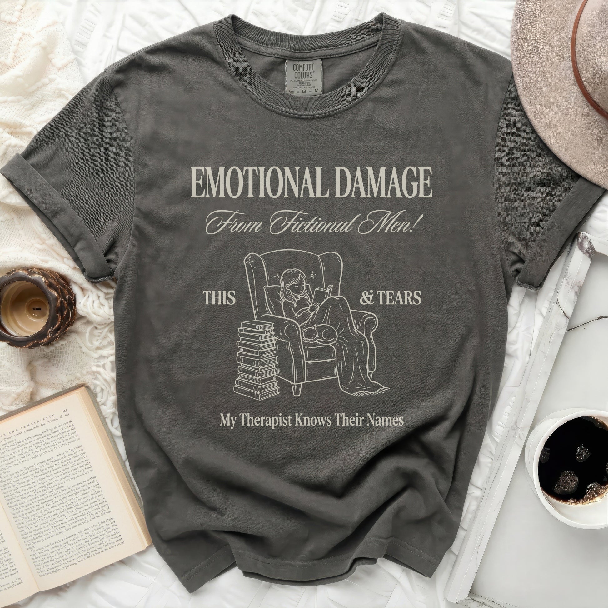 Dark grey t-shirt with "Emotional Damage From Fictional Men!" text and illustration.