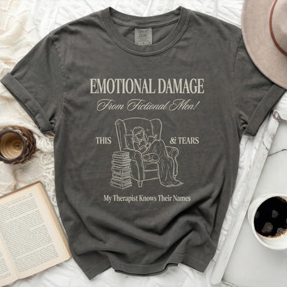 Dark grey t-shirt with "Emotional Damage From Fictional Men!" text and illustration.