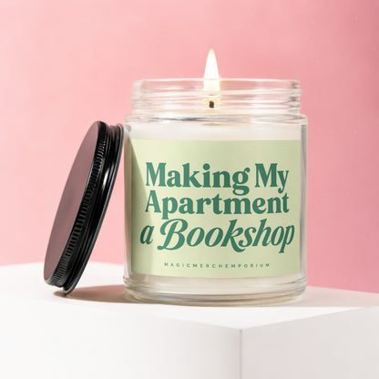 Glass candle with lit wick, featuring "Making My Apartment a Bookshop" text.