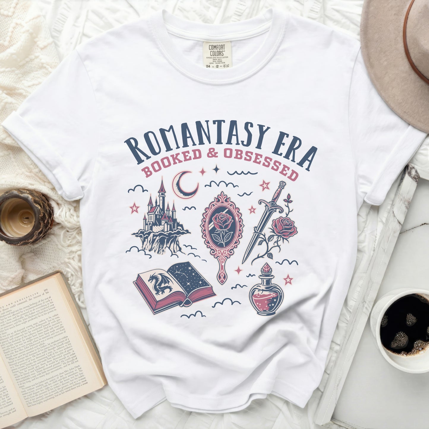 White t-shirt with "Romantasy Era Booked & Obsessed" graphic.