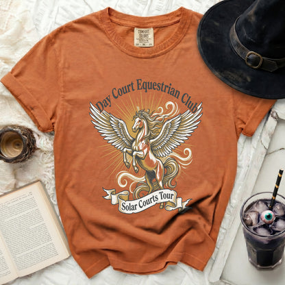 Orange t-shirt with Pegasus graphic and text "Day Court Equestrian Club Solar Courts Tour".