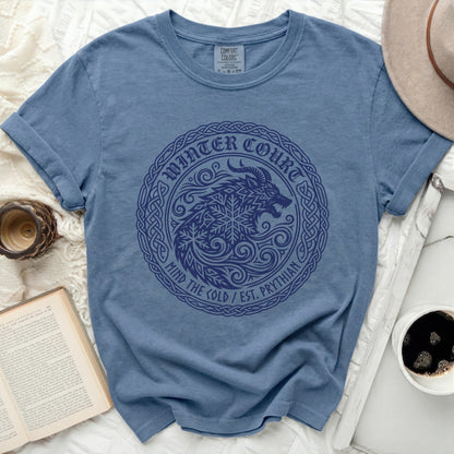 Blue t-shirt with circular "Winter Court" graphic of a wolf and snowflake.