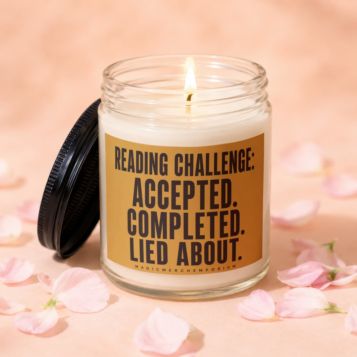 Glass candle with lit wick and label: Reading Challenge: Accepted. Completed. Lied About.