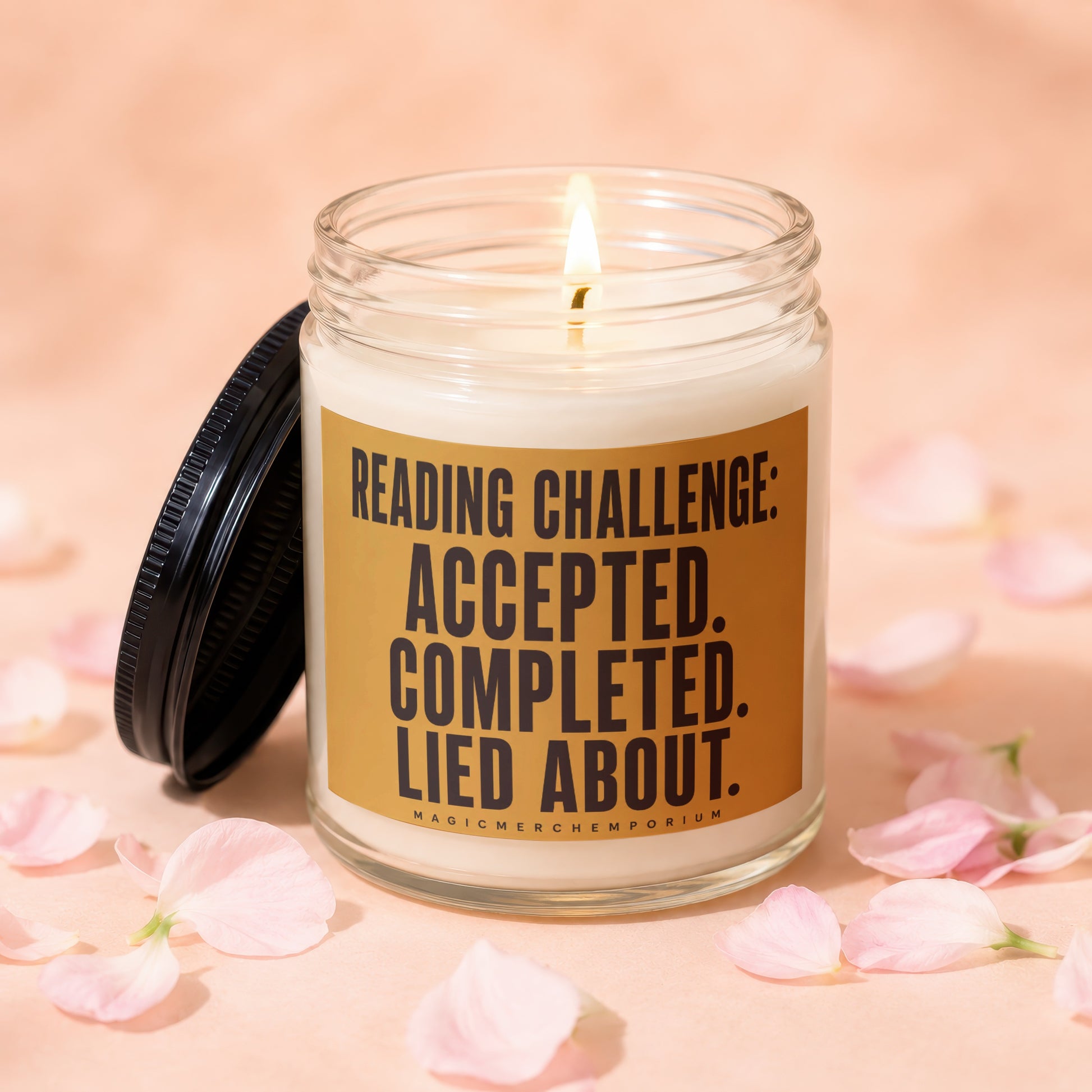 Glass candle with lit wick and label: Reading Challenge: Accepted. Completed. Lied About.