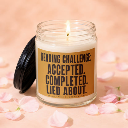 Glass candle with lit wick and label: Reading Challenge: Accepted. Completed. Lied About.