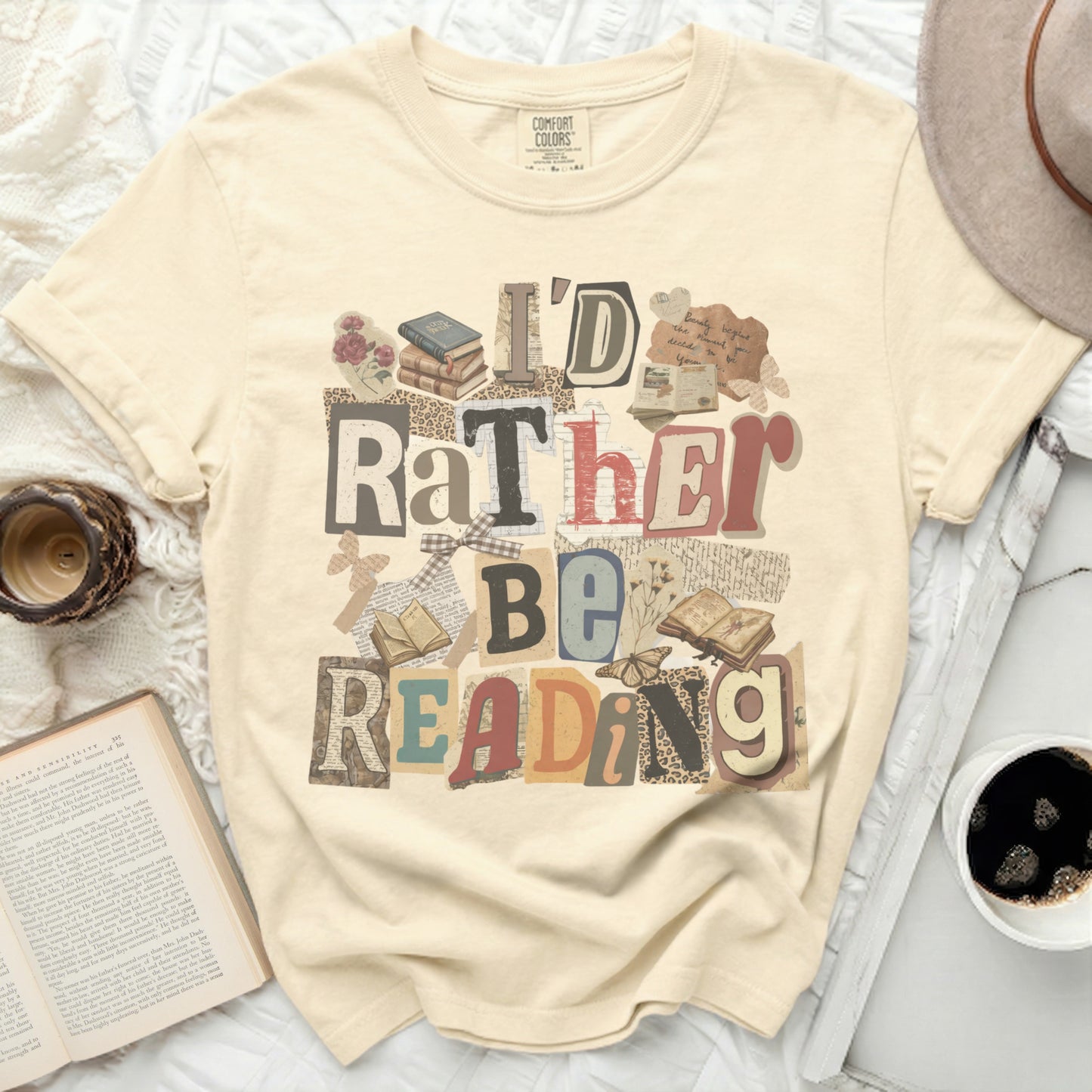Cream t-shirt with "I'd Rather Be Reading" text and book graphics.