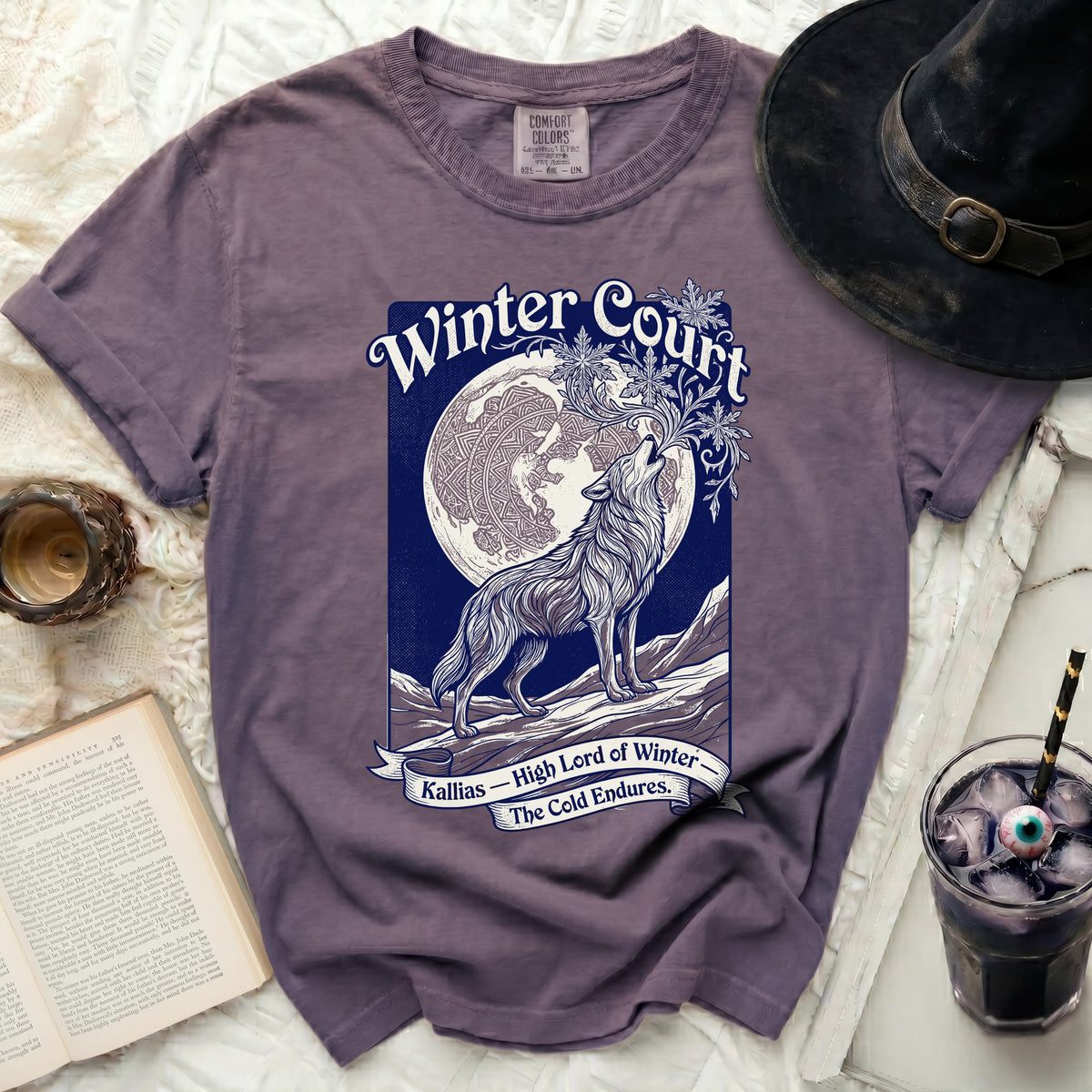 Purple Comfort Colors t-shirt with howling wolf and moon graphic and "Winter Court Kallias" text.