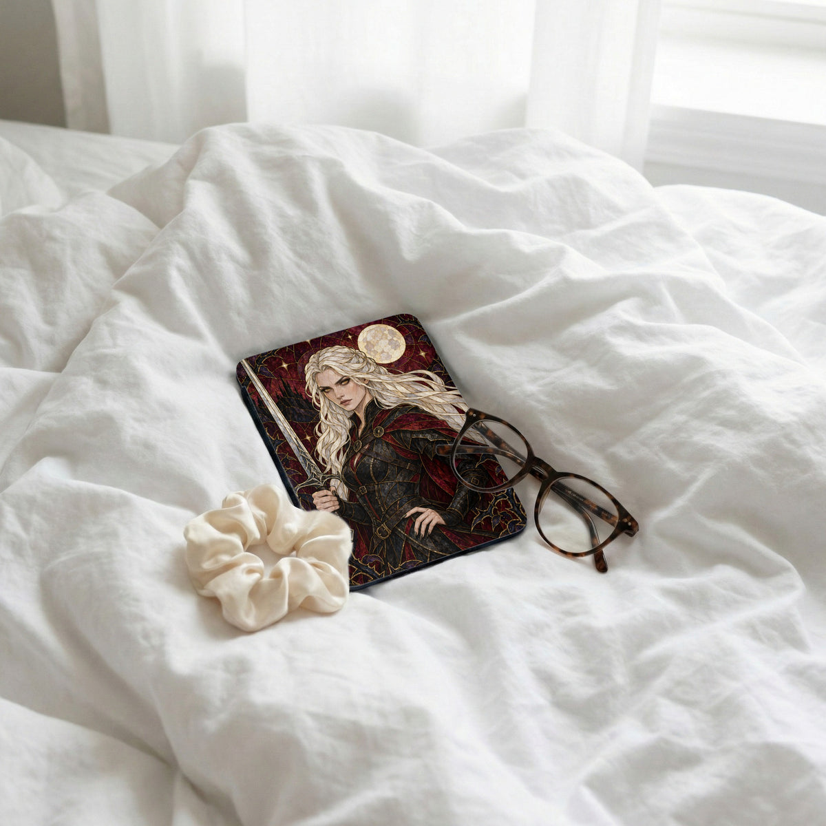 Book cover with fantasy art of a woman with a sword, glasses, and scrunchie on white sheets.