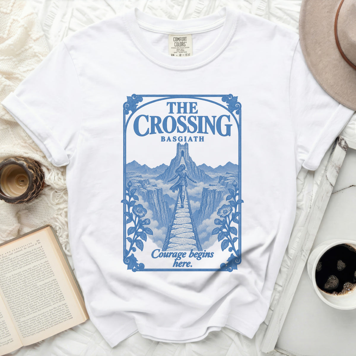 White t-shirt with "The Crossing Basgiath Courage begins here" blue graphic.