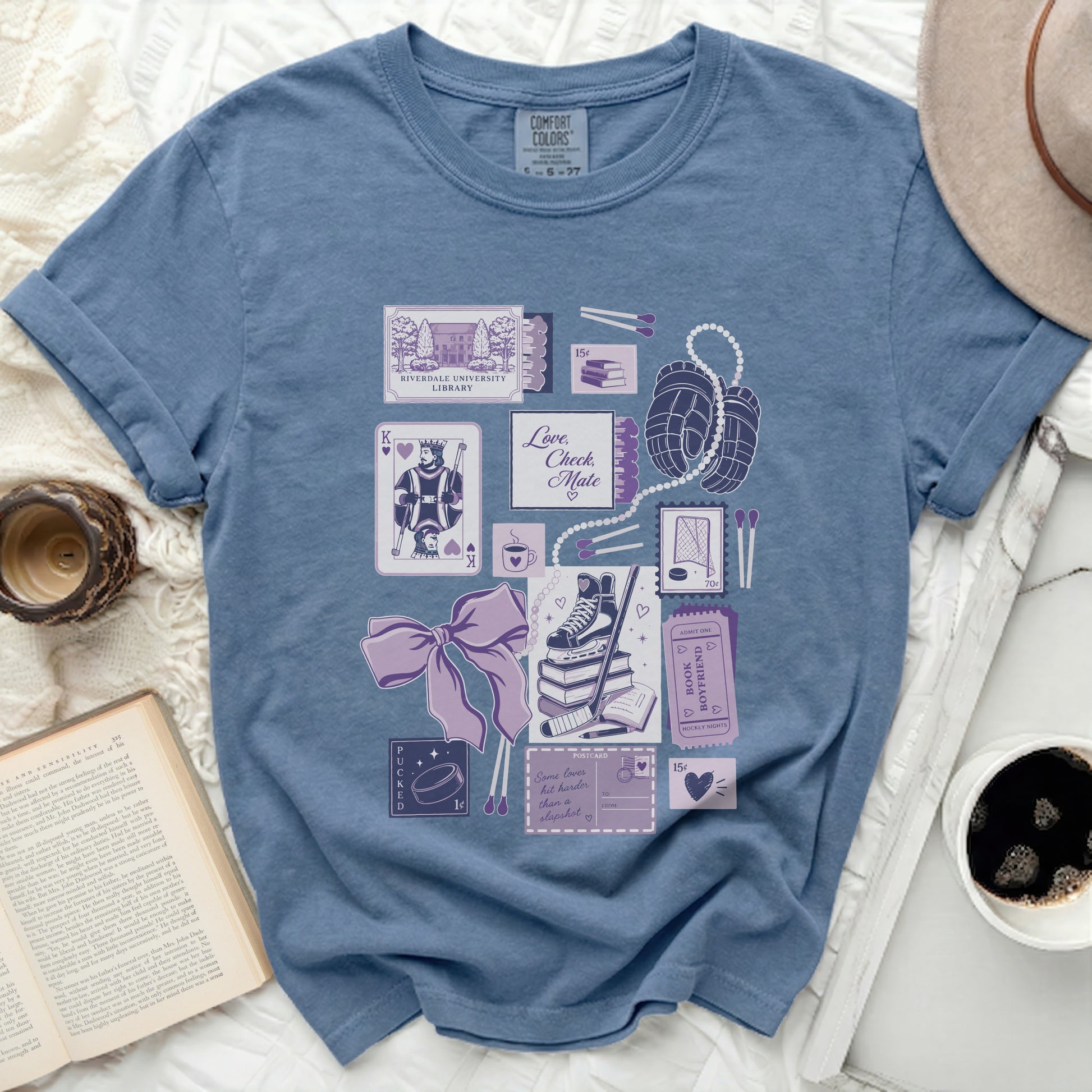 T-shirt with various illustrations of hockey and romantic themes, including cards, matches, and a book.