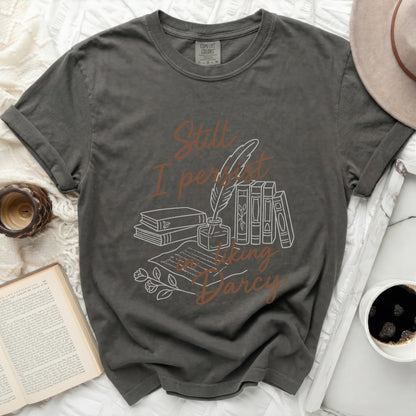Graphic t-shirt with literary design and text "Still I persist in liking Darcy."