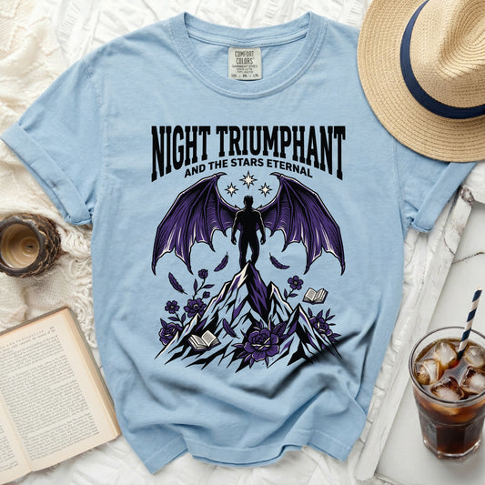 Light blue t-shirt with "Night Triumphant and the Stars Eternal" graphic.
