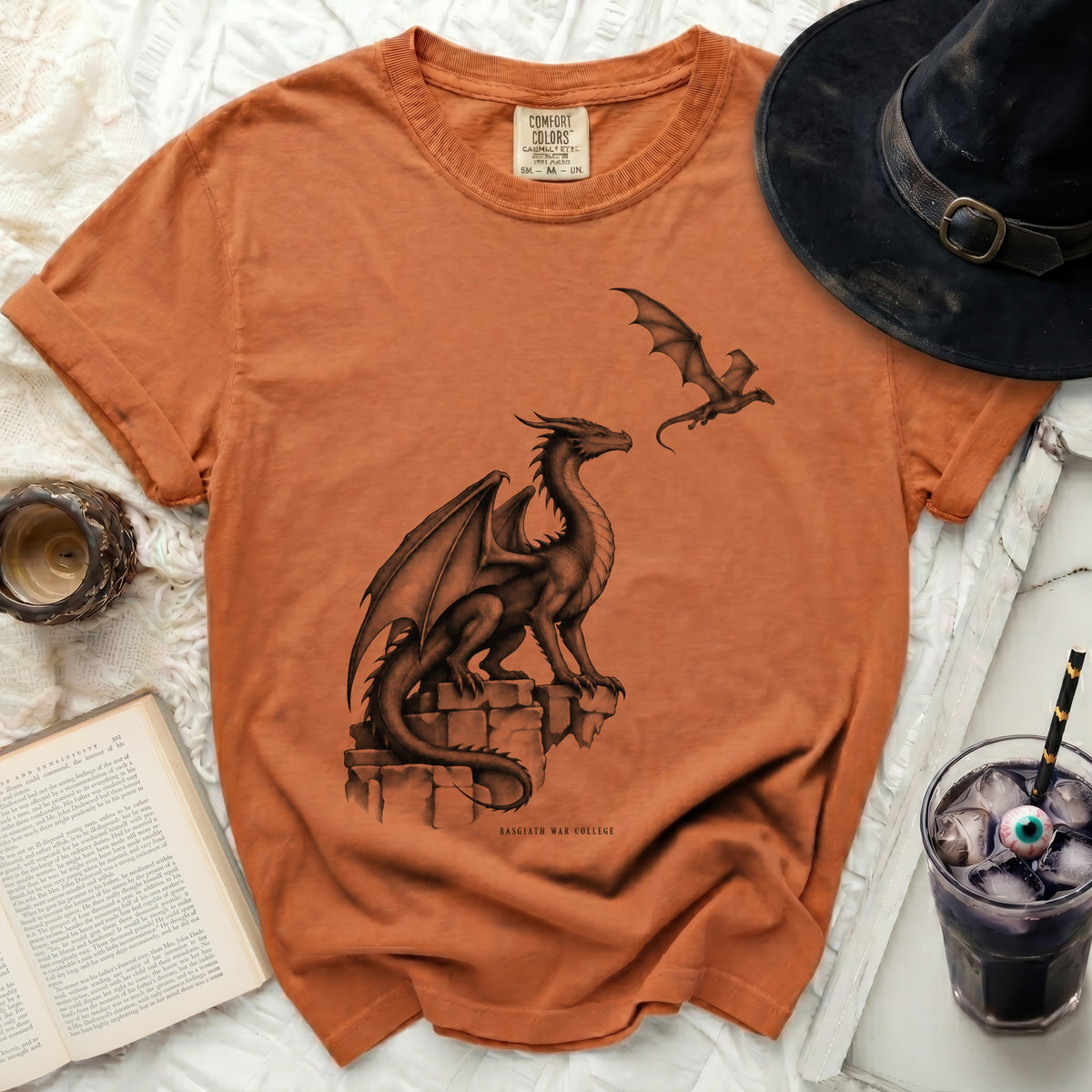 Orange t-shirt with two dragons and "Basgiath War College" text.