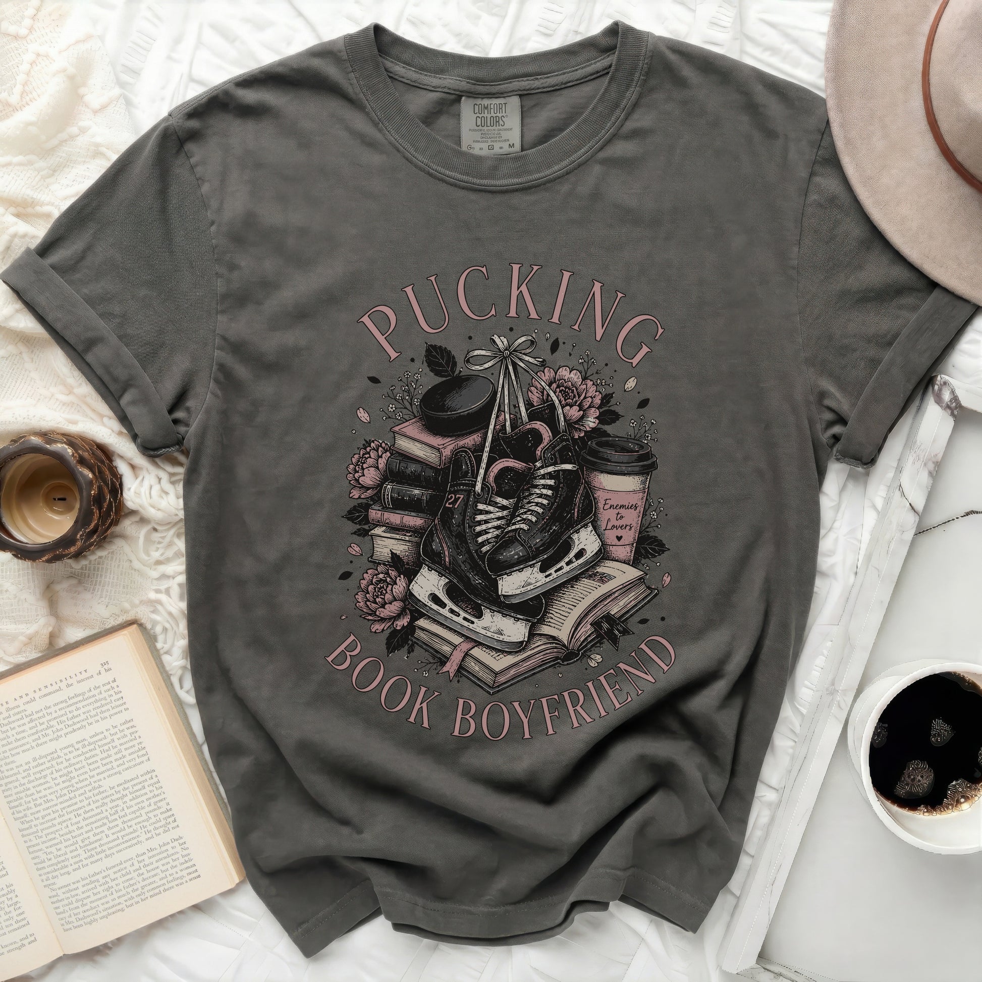 Dark gray t-shirt with "Pucking Enemies to Lovers Book Boyfriend" text and ice skates.