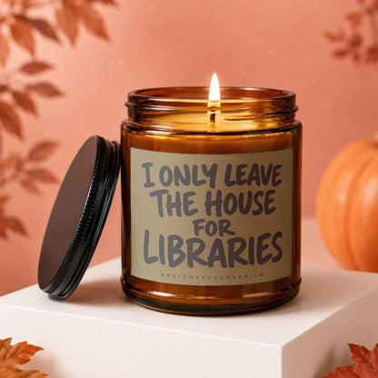 Amber glass candle with "I ONLY LEAVE THE HOUSE FOR LIBRARIES" text, lid detached.