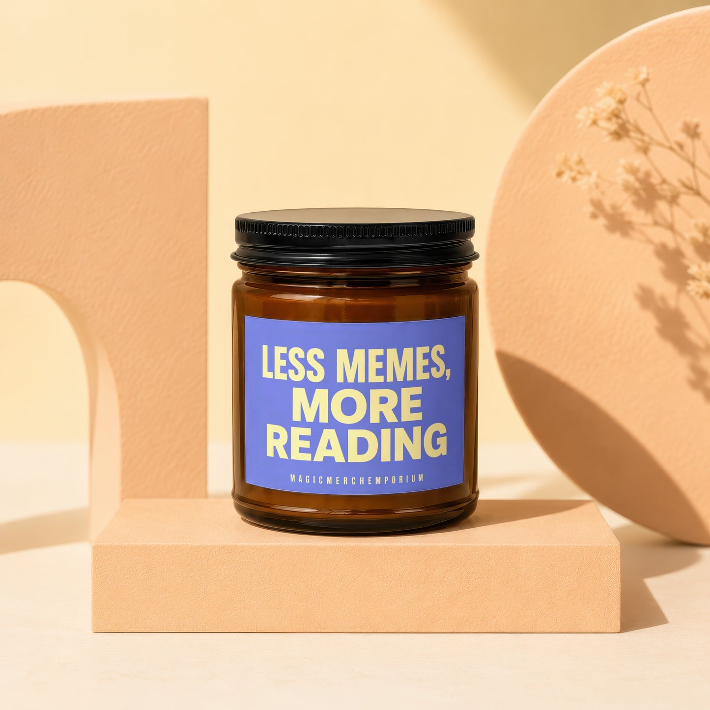 Amber jar candle with blue label reading "Less Memes, More Reading."
