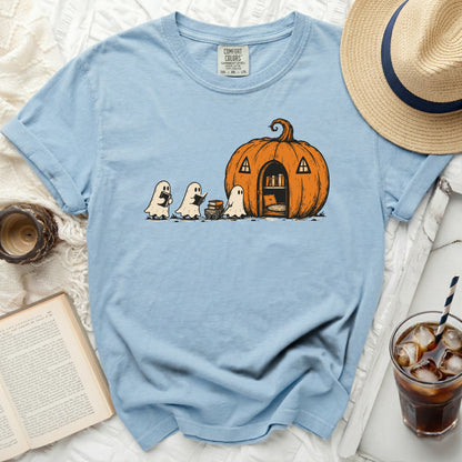 T-shirt with a light blue t-shirt featuring ghosts and a pumpkin house graphic.