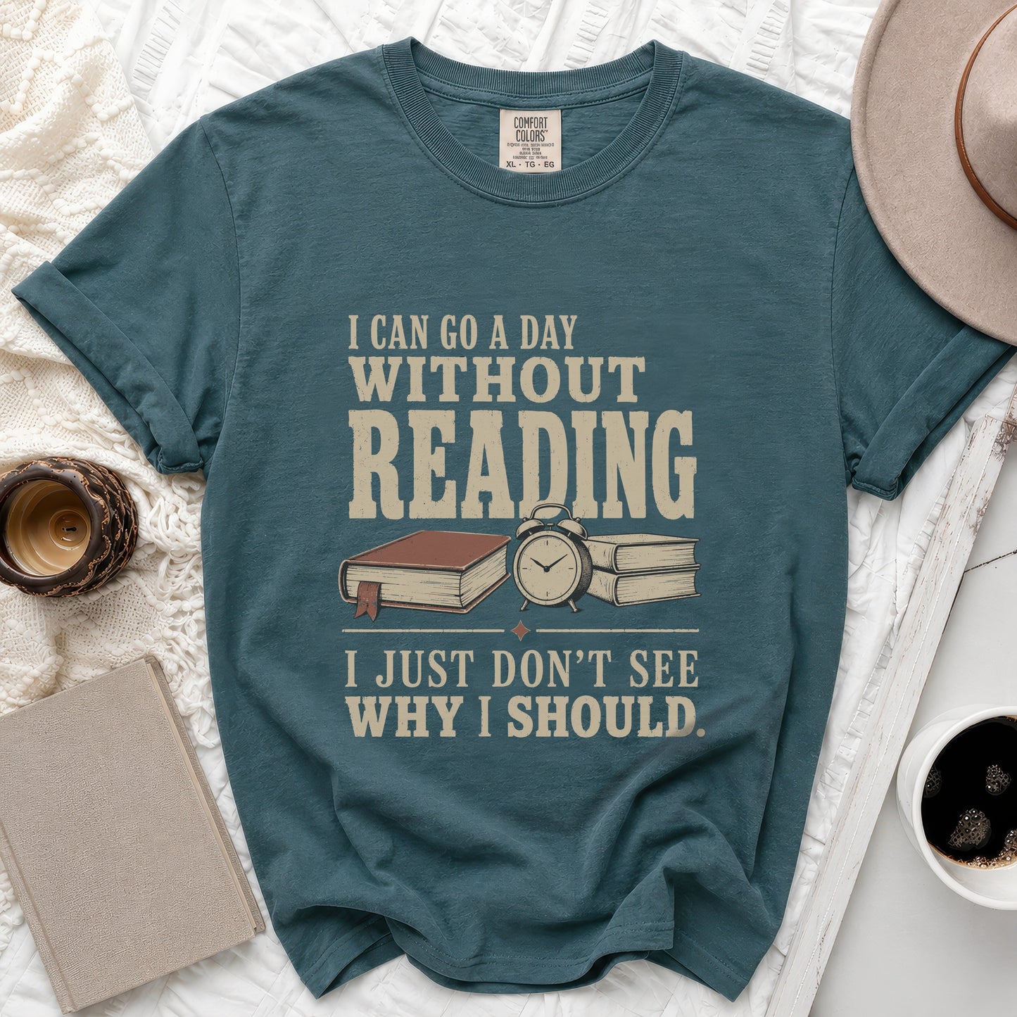 Teal t-shirt with "I can go a day without reading, I just don't see why I should."