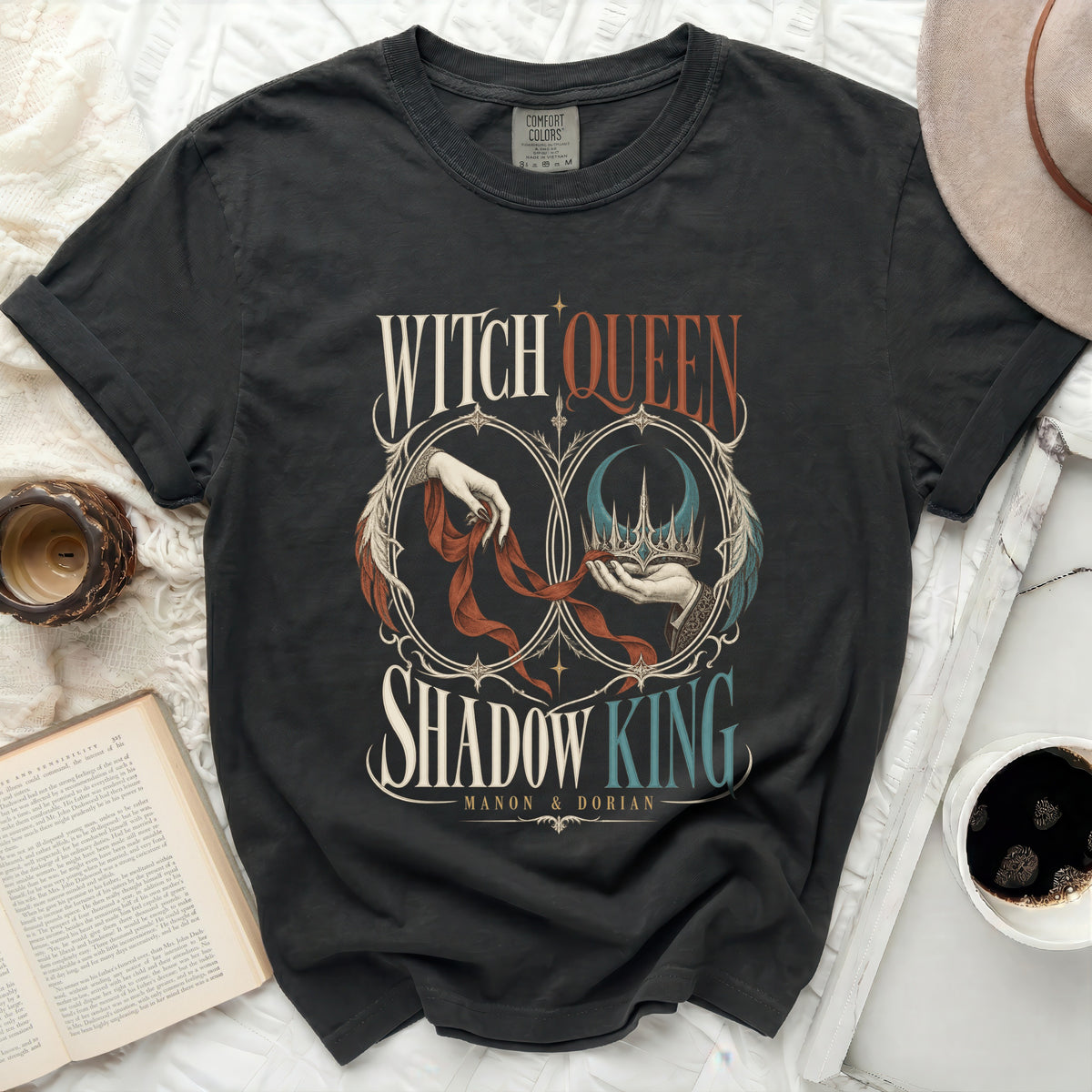 Dark grey t-shirt with "Witch Queen Shadow King Manon & Dorian" text and graphic.