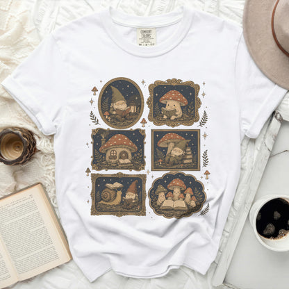 White crewneck t-shirt featuring a repeating graphic of gnomes, mushrooms, and snails reading books.