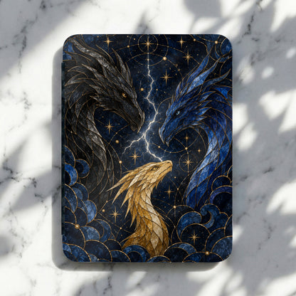 Three stylized dragons in black, blue, and gold against a starry, celestial background.