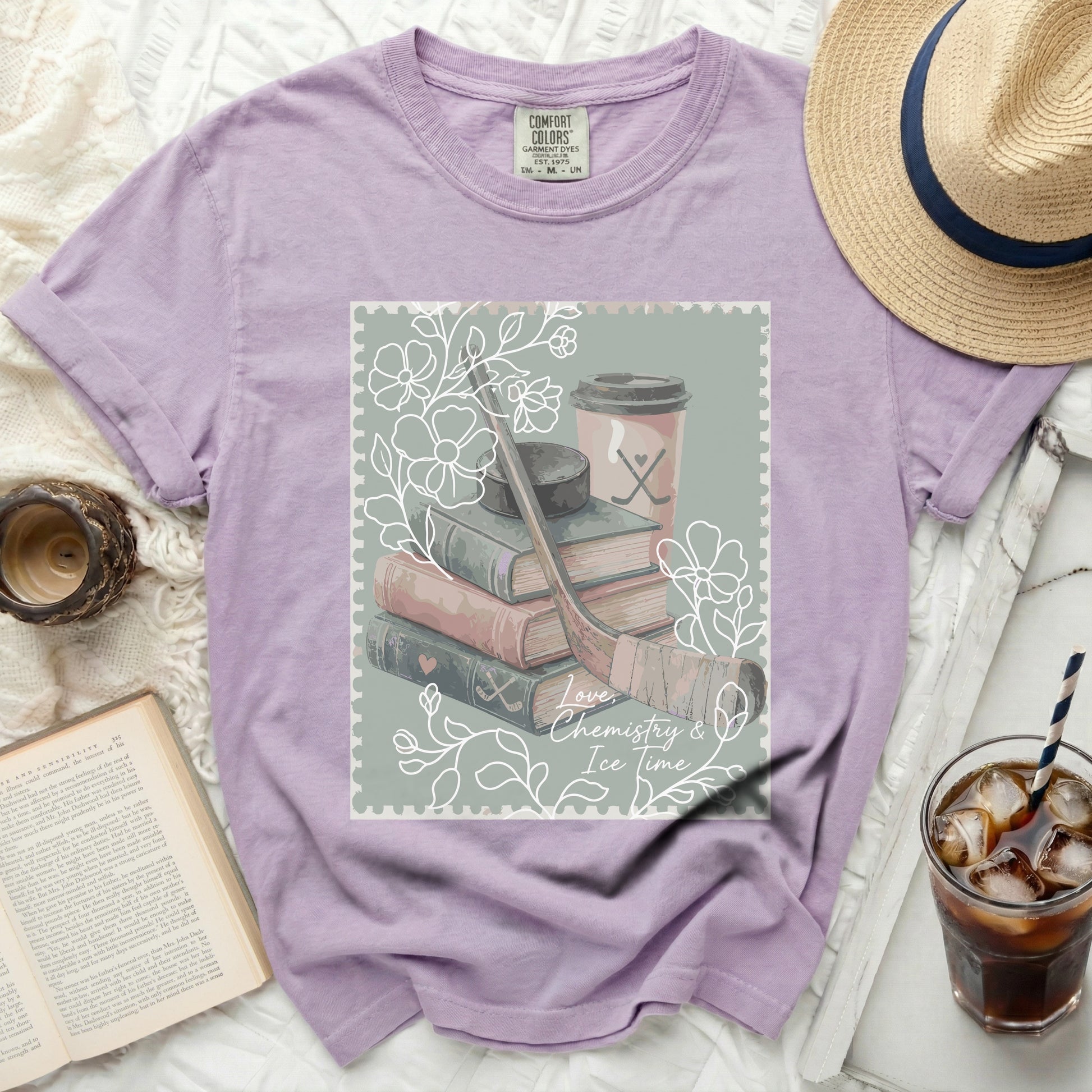 Comfort Colors t-shirt with stack of books, hockey sticks, coffee, and text.