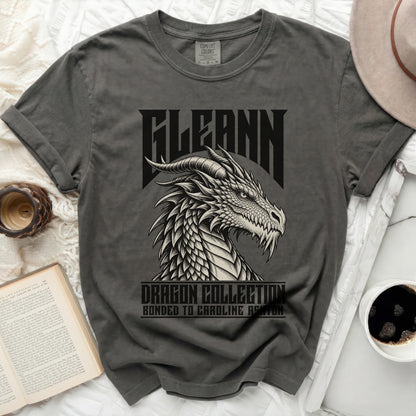 Gray t-shirt with dragon graphic and text "FLEANN DRAGON COLLECTION BONDED TO CAROLINE ASHTON".