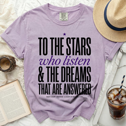 Purple t-shirt with text "To the stars who listen & the dreams that are answered".