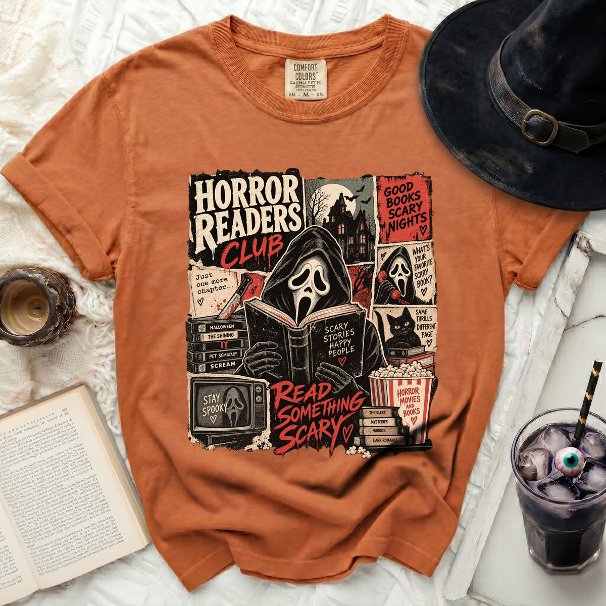 Orange t-shirt with "Horror Readers Club" graphic featuring ghost, haunted house, and books.