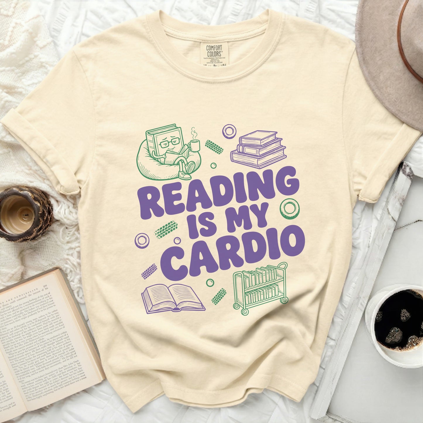 Cream t-shirt with "Reading Is My Cardio" text and book graphics.