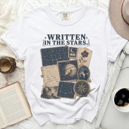 White t-shirt with "Written in the Stars" celestial graphic and constellations.