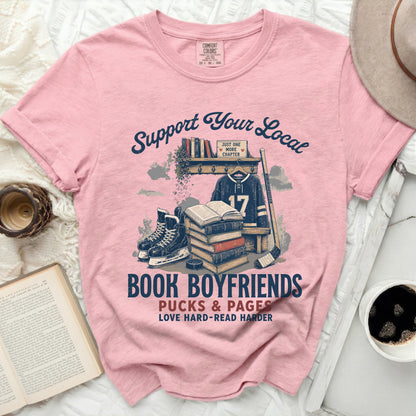 Pink t-shirt with "Book Boyfriends" graphic featuring books, hockey gear, and text.