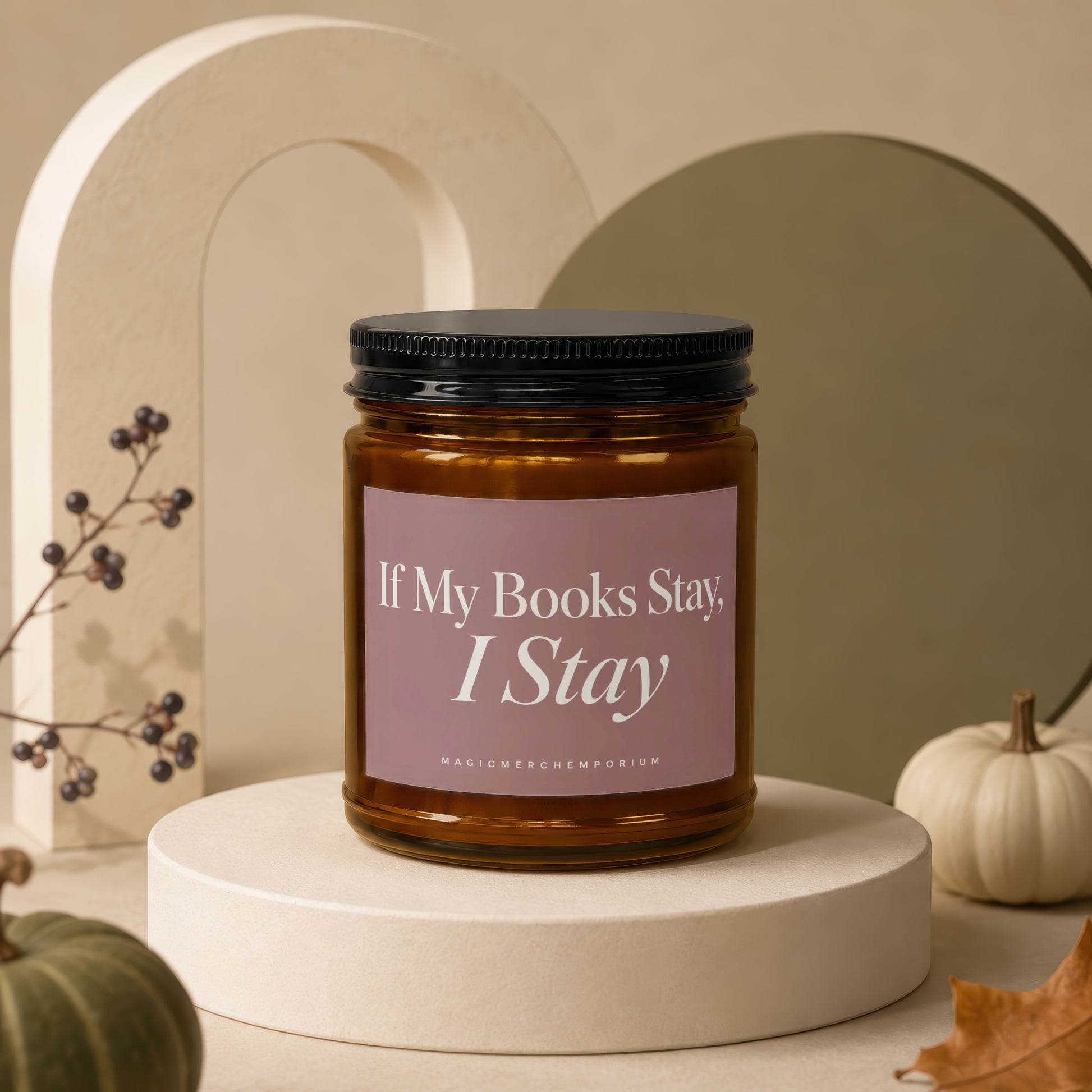 Amber jar candle with text "If My Books Stay, I Stay" on a pink label.