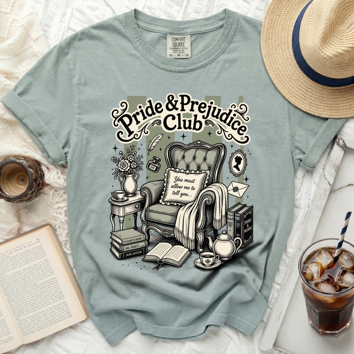 Pride & Prejudice Club graphic on a light green t-shirt.