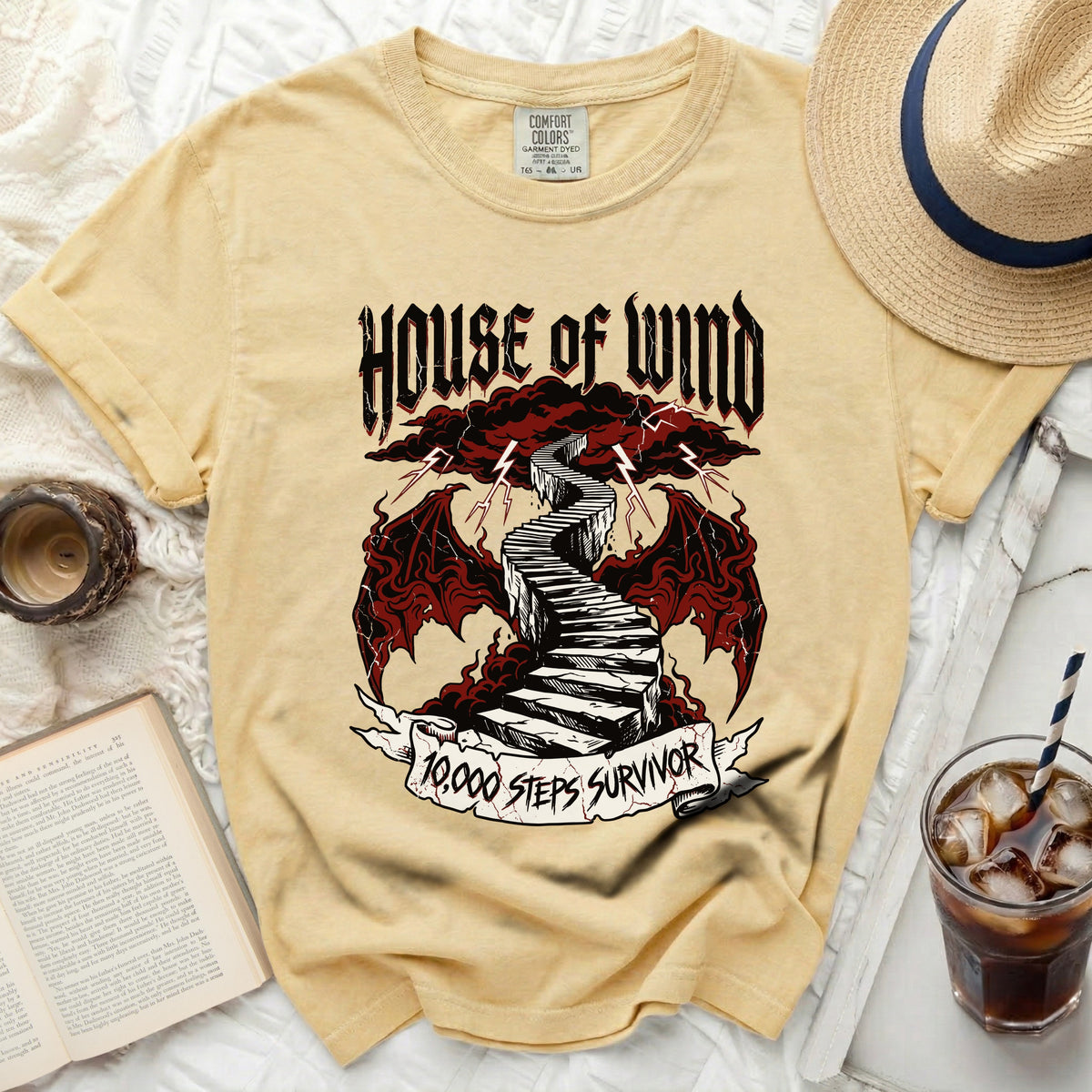 Yellow t-shirt with "House of Wind" and "10,000 Steps Survivor" graphic.