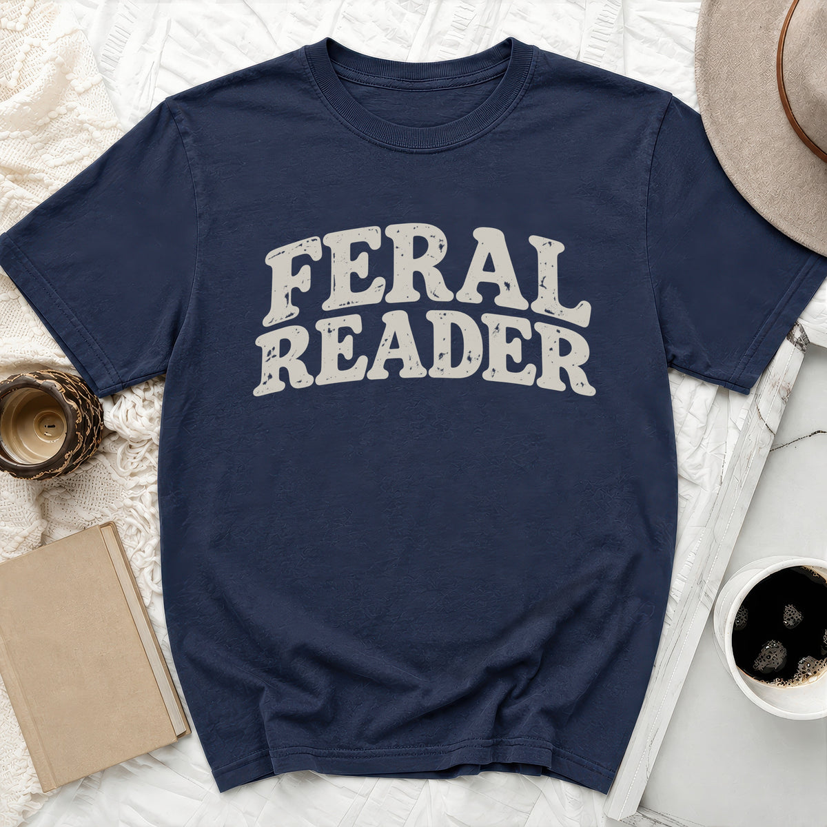 Navy t-shirt with distressed "Feral Reader" graphic text.