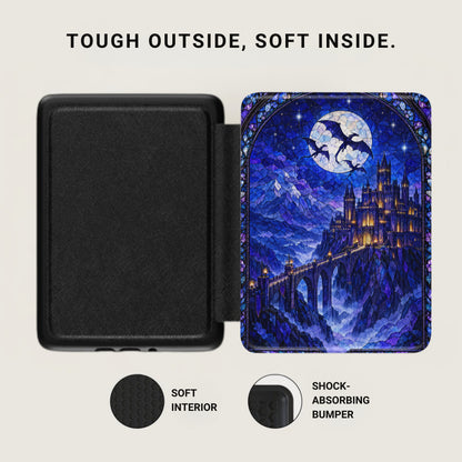 An open Kindle case with a soft black interior and a blue stained-glass castle exterior design.