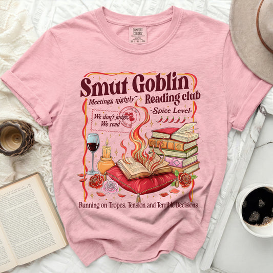 Pink t-shirt with "Smut Goblin Reading Club" and burning books design.