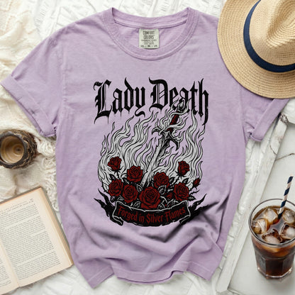 Purple t-shirt with "Lady Death" and sword graphic, red roses, and "Forged in Silver Flames" text.