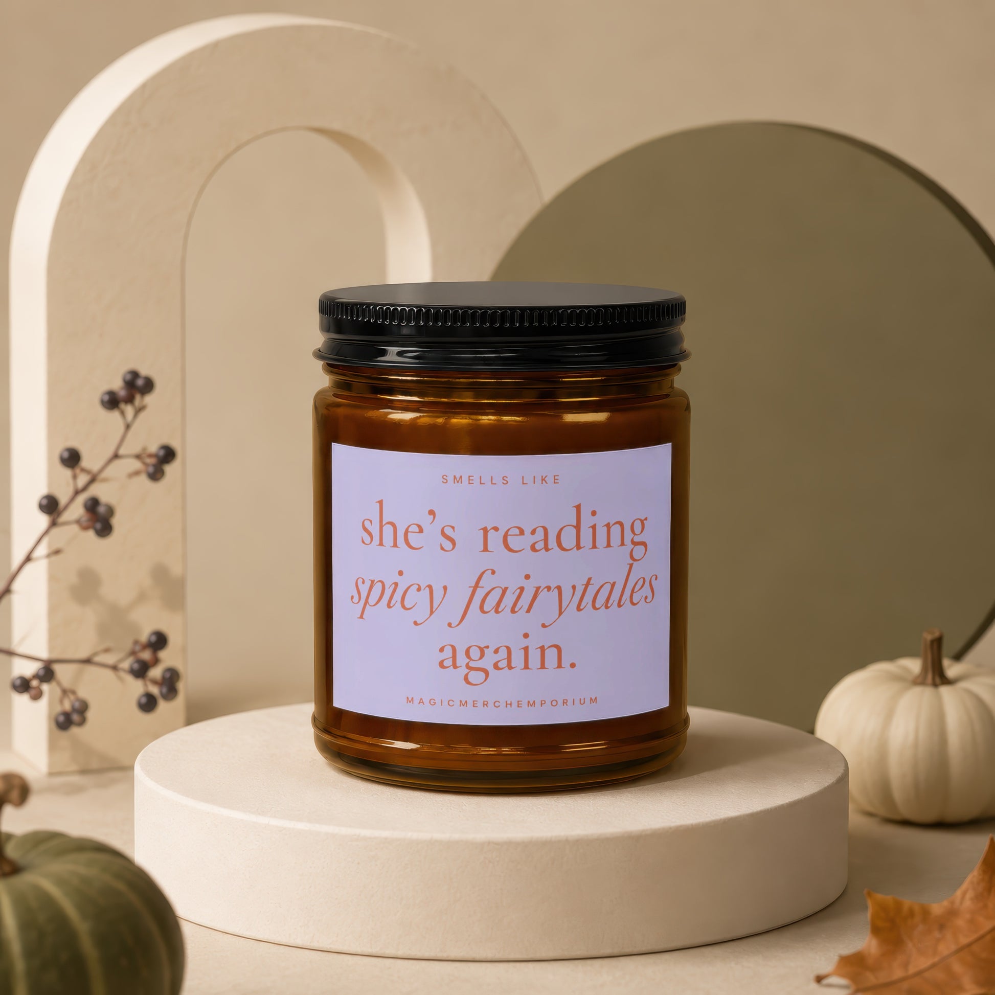 Brown candle with black lid, reading "she's reading spicy fairytales again."