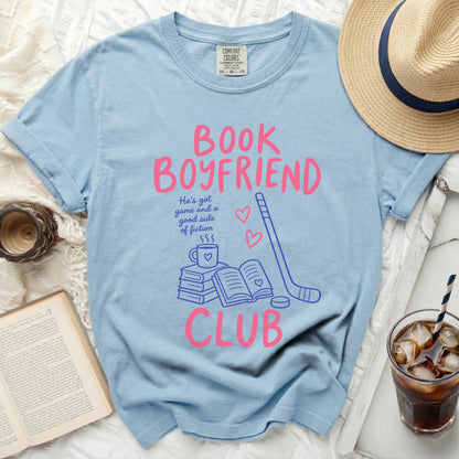 Light blue t-shirt with "BOOK BOYFRIEND" and reading/hockey graphic.