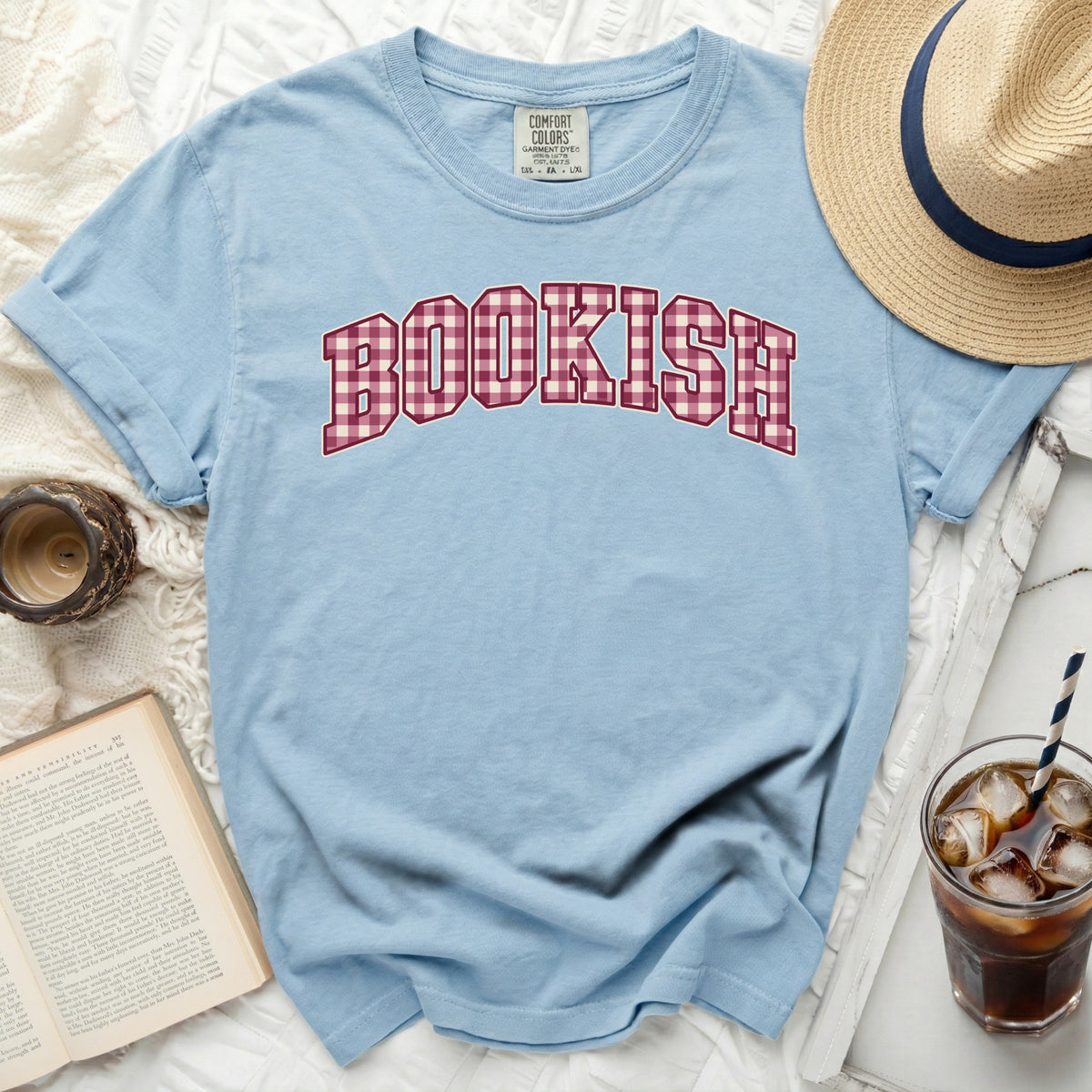 Light blue t-shirt with "BOOKISH" in red plaid collegiate lettering.