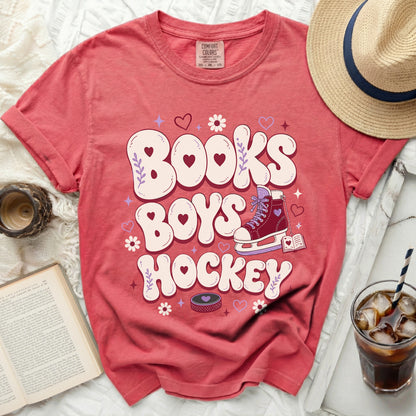 Red t-shirt with "Books Boys Hockey" in heart and book graphics.