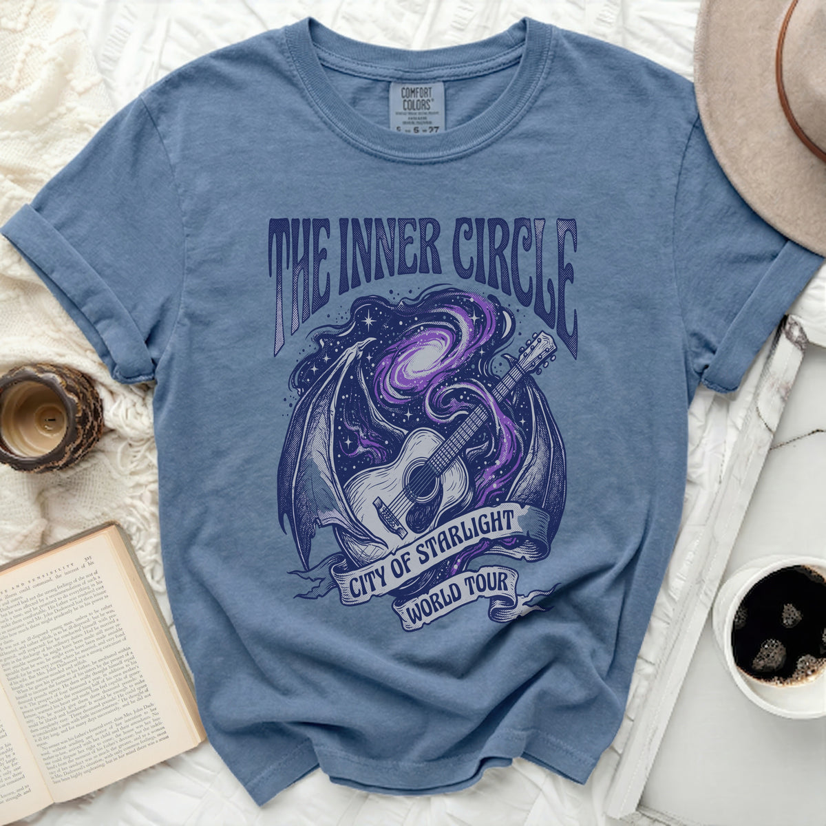 Blue t-shirt with "The Inner Circle City of Starlight World Tour" graphic.
